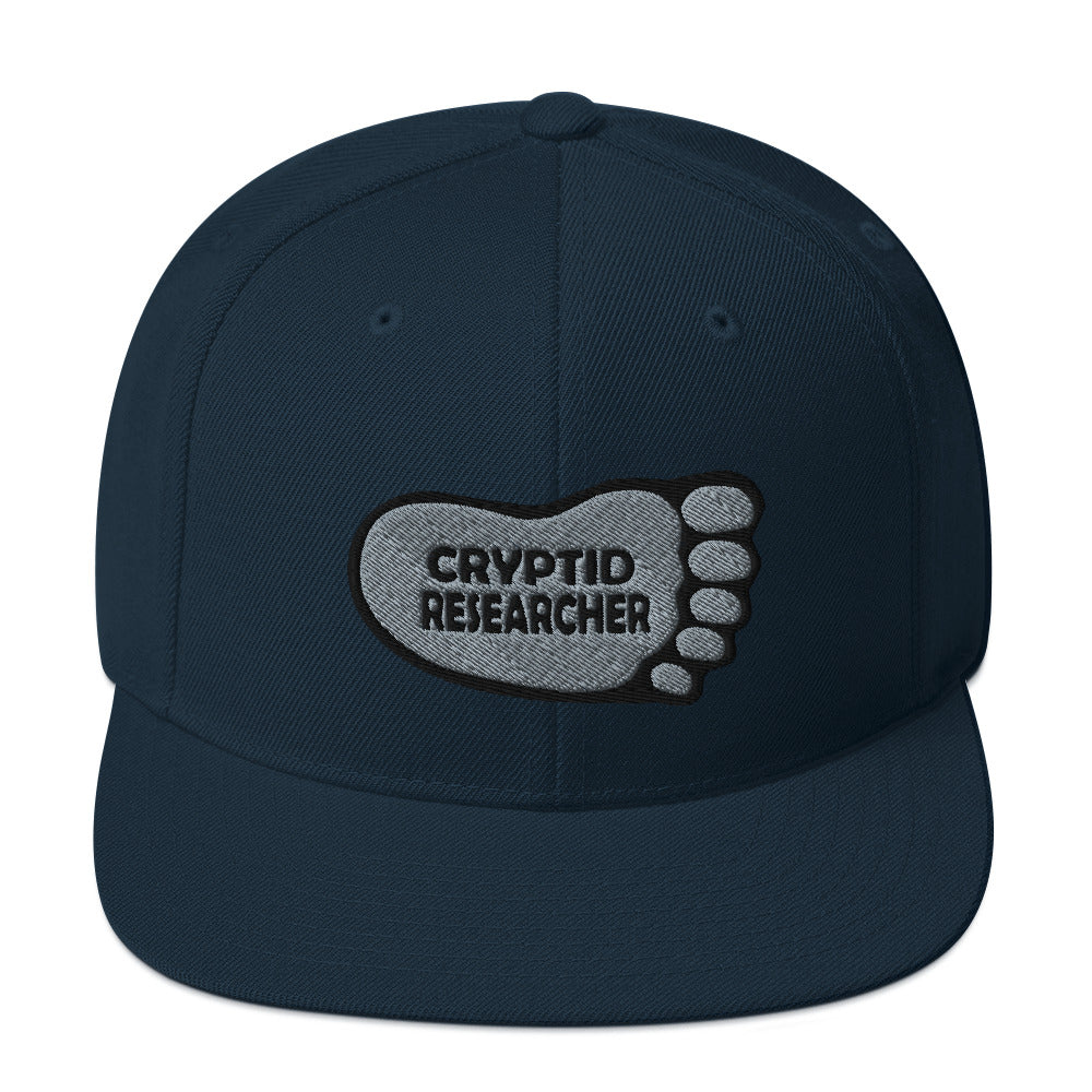 Navy Cryptid Researcher Snapback Hat cryptidcurosities