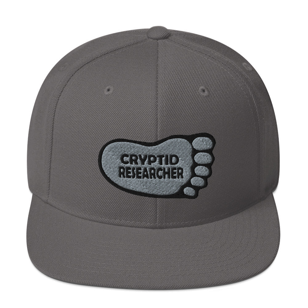 Grey Cryptid Researcher Snapback Hat cryptidcurosities
