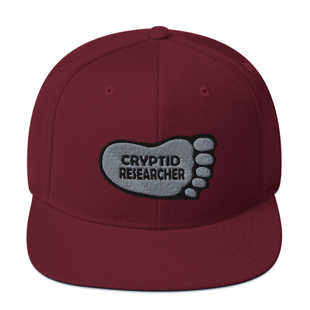 Maroon Cryptid Researcher Snapback Hat cryptidcurosities