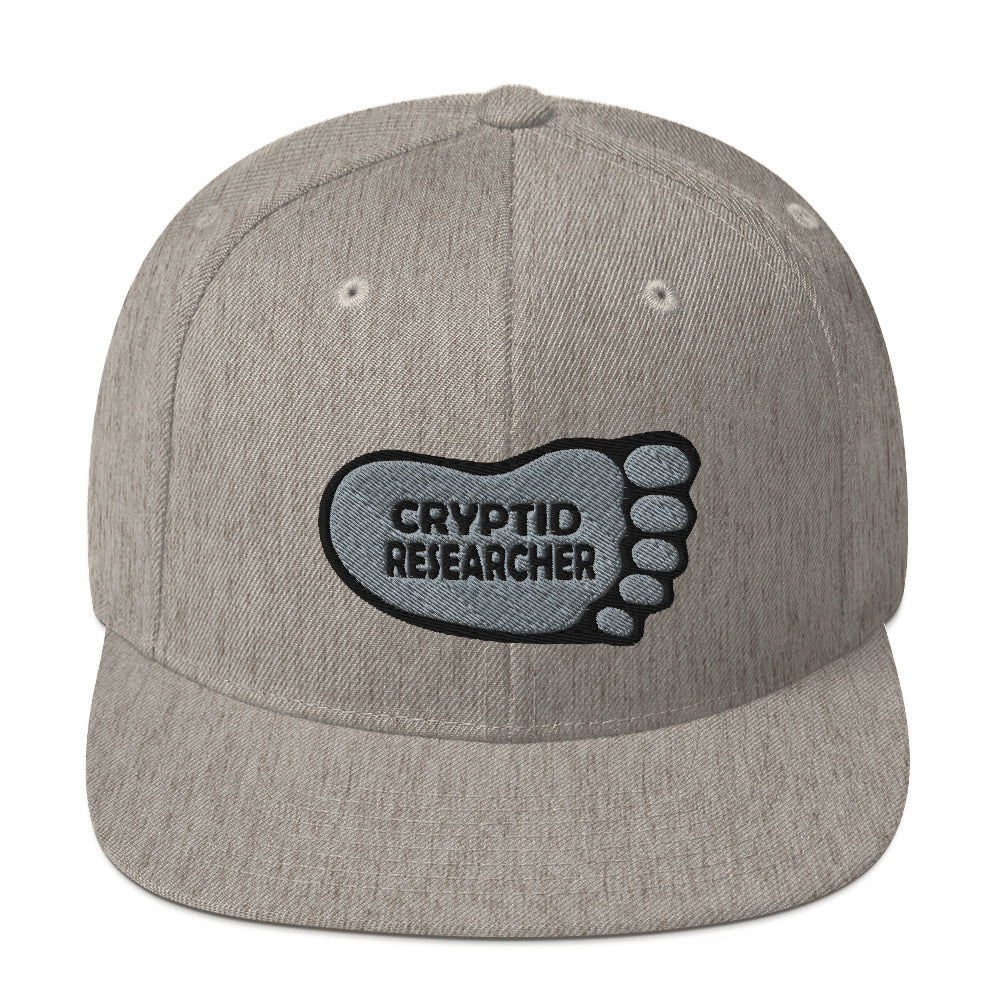 Heather Cryptid Researcher Snapback Hat cryptidcurosities