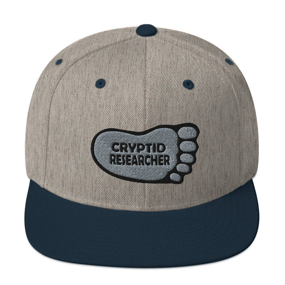 Heather Navy Cryptid Researcher Snapback Hat cryptidcurosities