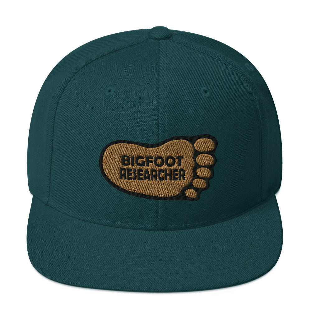 Spruce Bigfoot Researcher Snapback Hat cryptidcurosities